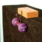 A unique, non-damaging hanging hook which can be moved as many times as you desire! This all wood block with a black iron hood will hold over 2 pounds when on a solid, level and flat surface. Perfect for displaying holiday decorations. Made by WDI.